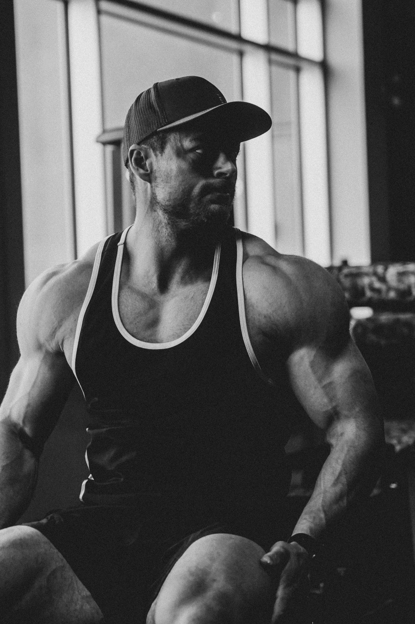 Cody from GRO Physique in gym lighting